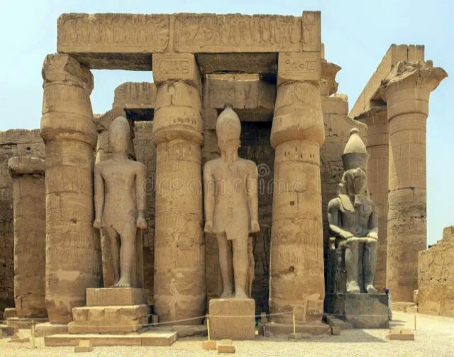 https://bluetours.net/wp-content/uploads/2025/06/colossal-statue-seated-king-entrance-to-colonnade-hall-rameses-ii-court-luxor-temple-pictured-ramesses-amenhotep-253678775-640x504.jpeg